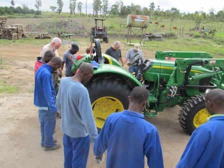Praying around the new John Deere orchard tractor