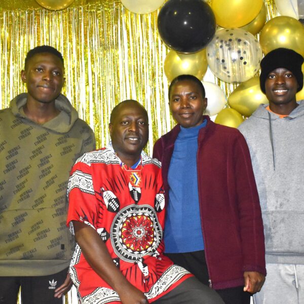 Sydney & Misozi Mhango with their sons Benjamin & Mluleki at the celebration for Mhango's 20 years.