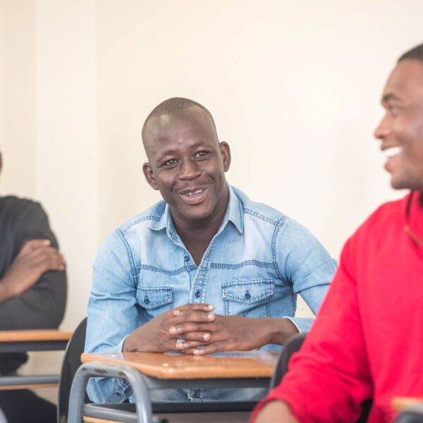 Elia and students smiling during class discussion